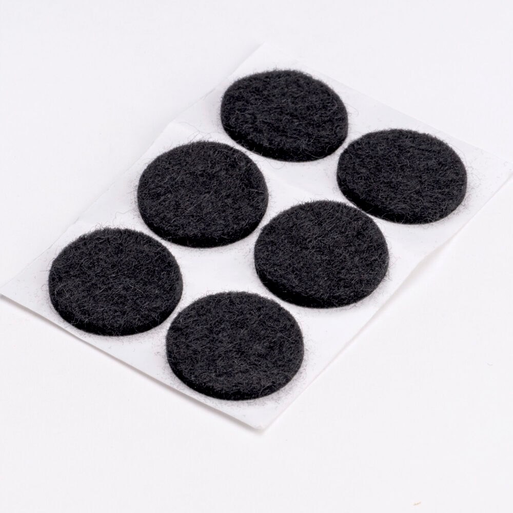 Adhesive backed felt disc.