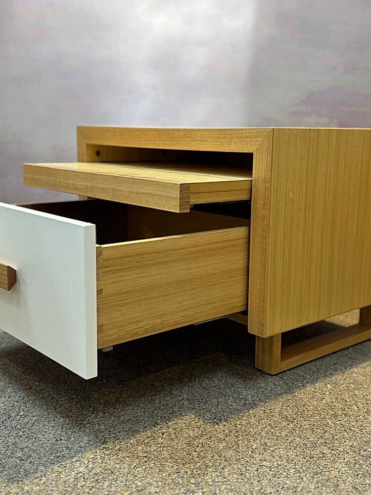 Adelaide, South Australian made oak timber bedside table with drawer and hidden shelf. Side view of drawer and shelf