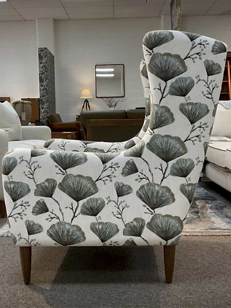 Molmic, Melbourne made fully pattern upholstered occasional chair with timber legs. View of side