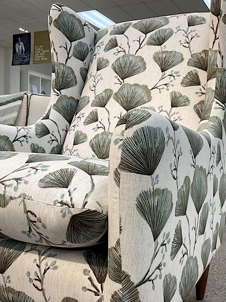 Molmic, Melbourne made fully pattern upholstered occasional chair with timber legs. View of arm