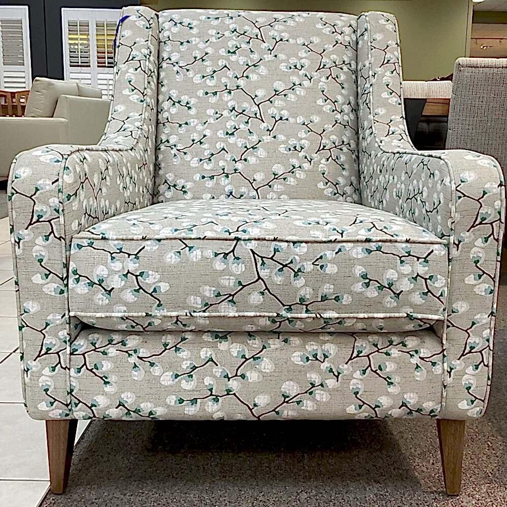 Molmic, Melbourne made fully pattern upholstered occasional chair with timber legs. View of front