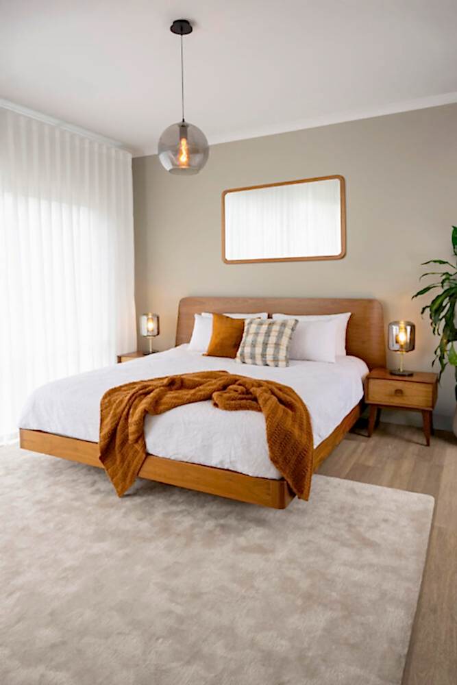 Adelaide, South Australian made solid walnut timber floating bed with curved bedhead. View of front