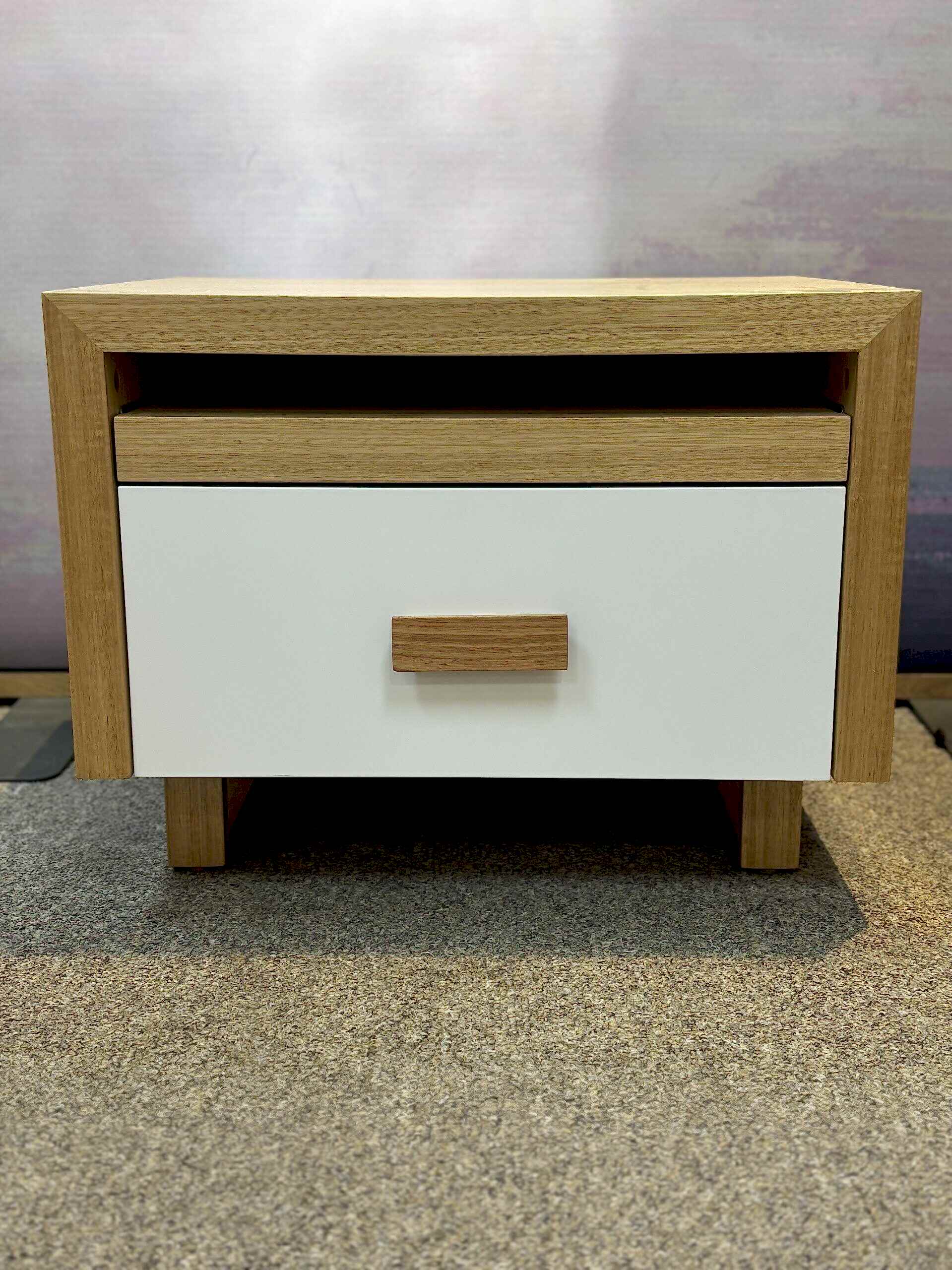 Adelaide, South Australian made oak timber bedside table with drawer and hidden shelf. Front view