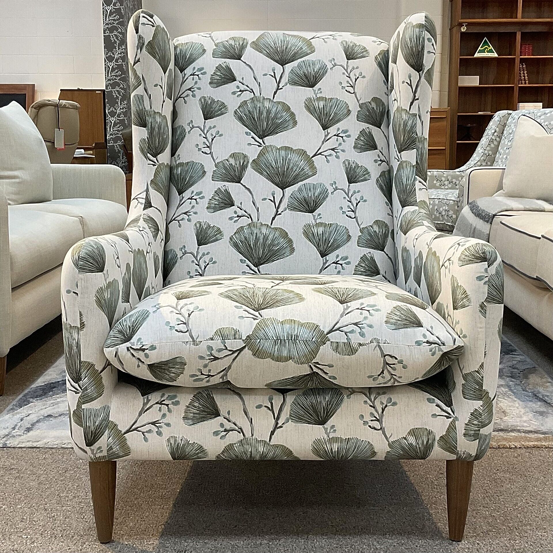 Molmic, Melbourne made fully pattern upholstered occasional chair with timber legs. View of front