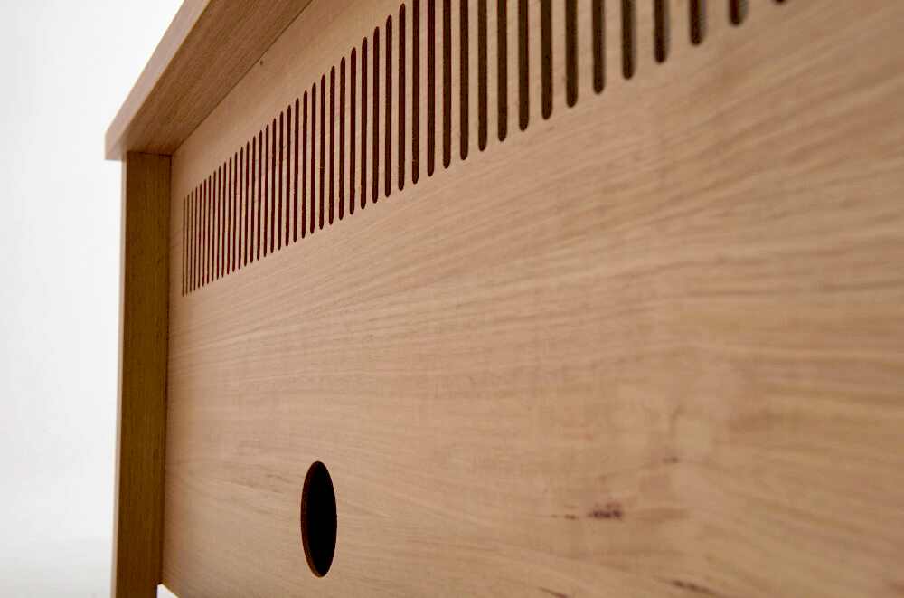 Entertainment cabinets have a 50mm recess and rear venting for heat to escape