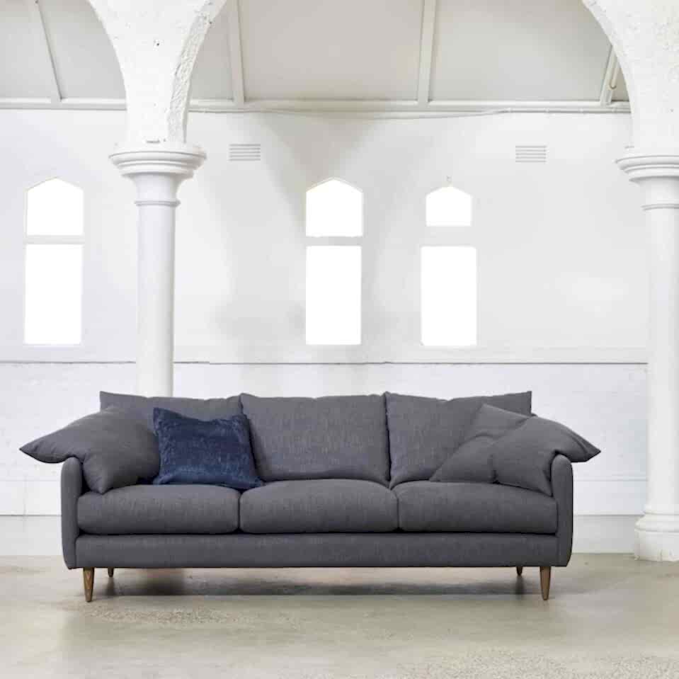 Floyd sofa lounge by Molmic with Danish feet and loose back cushions
